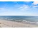 Aerial view of beach showing ocean, sand, and a pier in the distance at 2709 Ocean Blvd. S # 1202, Myrtle Beach, SC 29577