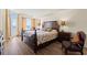 Bedroom with king bed, ocean view, and sitting area at 2709 Ocean Blvd. S # 1202, Myrtle Beach, SC 29577