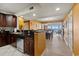 Kitchen with dark wood cabinets and granite countertops at 2709 Ocean Blvd. S # 1202, Myrtle Beach, SC 29577