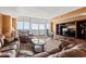 Spacious living room with ocean view and leather furniture at 2709 Ocean Blvd. S # 1202, Myrtle Beach, SC 29577