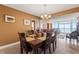 Dining room with a wooden table and chairs, overlooking ocean at 2709 Ocean Blvd. S # 1202, Myrtle Beach, SC 29577