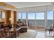 Living room with ocean view and comfortable leather furniture at 2709 Ocean Blvd. S # 1202, Myrtle Beach, SC 29577
