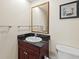 Bathroom with single sink, granite countertop, and toilet at 2709 Ocean Blvd. S # 1202, Myrtle Beach, SC 29577