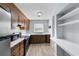 Efficient kitchen with wood cabinets and a window at 4505 N Kings Hwy. # C3, Myrtle Beach, SC 29577