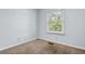 Simple bedroom with light gray walls, carpet, and a window with blinds at 4505 N Kings Hwy. # C3, Myrtle Beach, SC 29577