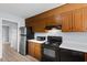 Galley kitchen with wood cabinets and appliances at 4505 N Kings Hwy. # C3, Myrtle Beach, SC 29577
