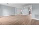 Open living area with wood-look floors and access to the kitchen at 4505 N Kings Hwy. # C3, Myrtle Beach, SC 29577