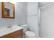 Clean bathroom with wood vanity, shower, and white toilet at 4505 N Kings Hwy. # C3, Myrtle Beach, SC 29577