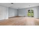 Spacious living room featuring light gray walls and wood-look flooring at 4505 N Kings Hwy. # C3, Myrtle Beach, SC 29577