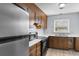 Bright kitchen with wood cabinets, stainless steel appliances, and tile flooring at 4505 N Kings Hwy. # C3, Myrtle Beach, SC 29577