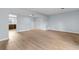 Living area with light walls, wood-look floors, and views into kitchen at 4505 N Kings Hwy. # C3, Myrtle Beach, SC 29577