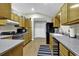Modern kitchen with stainless steel appliances and light wood cabinets at 153 Garden Ave., Georgetown, SC 29440