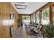 Bright sunroom with multiple windows and wood walls at 153 Garden Ave., Georgetown, SC 29440