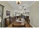 Spacious dining room with large wood table and access to living room at 153 Garden Ave., Georgetown, SC 29440