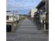 Wooden boardwalk with boats and buildings alongside at 153 Garden Ave., Georgetown, SC 29440
