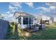 Home's backyard features a deck, sunroom, and grill at 2998 Skylar Dr., Myrtle Beach, SC 29577