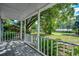 Screened porch overlooking a tree-lined street at 504 Birch St., Georgetown, SC 29440