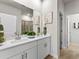 Double vanity bathroom with white cabinets and a large mirror at 680 Blackthorne Circle Nw, Calabash, NC 28467