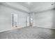 Spacious bedroom with gray carpet and access to bathroom and kitchen at 680 Blackthorne Circle Nw, Calabash, NC 28467