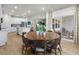 Bright dining area with a large round table and access to a patio at 680 Blackthorne Circle Nw, Calabash, NC 28467