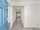 Light and bright entryway with blue door and gray vinyl flooring at 680 Blackthorne Circle Nw, Calabash, NC 28467