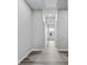 Bright hallway with wood-look floors and neutral walls at 680 Blackthorne Circle Nw, Calabash, NC 28467
