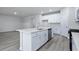 Modern kitchen with white cabinets, quartz countertops, and island at 680 Blackthorne Circle Nw, Calabash, NC 28467