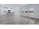 Modern kitchen with white cabinets, island, and stainless steel appliances at 680 Blackthorne Circle Nw, Calabash, NC 28467