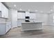 Modern kitchen with white cabinets, quartz countertops, and island at 680 Blackthorne Circle Nw, Calabash, NC 28467