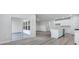 Open kitchen with sliding glass door leading to a patio at 680 Blackthorne Circle Nw, Calabash, NC 28467