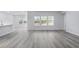 Spacious living area with vinyl plank flooring and abundant natural light at 680 Blackthorne Circle Nw, Calabash, NC 28467