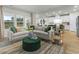 Spacious living room with a comfortable sofa and views into the kitchen at 680 Blackthorne Circle Nw, Calabash, NC 28467