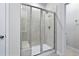 Walk-in shower with glass enclosure and built-in seat at 680 Blackthorne Circle Nw, Calabash, NC 28467