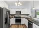 Modern kitchen with white cabinets and granite countertops at 481 Irees Way, Longs, SC 29568
