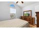 Bedroom with wood-look floors and arched window at 481 Irees Way, Longs, SC 29568