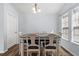 Bright dining room features a table with six chairs and large windows at 481 Irees Way, Longs, SC 29568