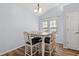 Bright dining area with table, six chairs, and hardwood floors at 481 Irees Way, Longs, SC 29568