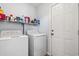 Laundry room with washer, dryer, and storage shelves at 481 Irees Way, Longs, SC 29568