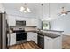 Modern kitchen with granite countertops and stainless steel appliances at 481 Irees Way, Longs, SC 29568