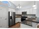 Modern kitchen with white cabinets, granite countertops, and stainless steel appliances at 481 Irees Way, Longs, SC 29568