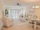 Living room with seating, dining area, and sliding doors at 110 South Shore Blvd. # 103, Longs, SC 29568