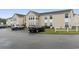 Exterior of building with cars parked nearby at 8546 Hopkins Circle # G, Surfside Beach, SC 29575