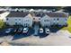 Tan colored building with multiple units, ample parking, and landscaping at 8546 Hopkins Circle # G, Surfside Beach, SC 29575