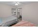 Bright bedroom with two beds, mirrored closet, and pool view at 8546 Hopkins Circle # G, Surfside Beach, SC 29575