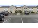 Building exterior, showing parking lot and landscaping at 8546 Hopkins Circle # G, Surfside Beach, SC 29575