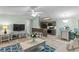 Living room with open concept kitchen, light walls, and a comfy couch at 8546 Hopkins Circle # G, Surfside Beach, SC 29575