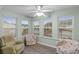 Bright sunroom with multiple windows offering a view of the community at 8546 Hopkins Circle # G, Surfside Beach, SC 29575