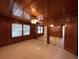 Cozy bedroom with wood paneled walls and mirrored closet doors at 848 S Waccamaw Dr., Garden City Beach, SC 29576