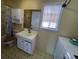 Clean bathroom with a tub, shower, and updated vanity at 848 S Waccamaw Dr., Garden City Beach, SC 29576