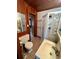 Bathroom with shower stall and updated vanity at 848 S Waccamaw Dr., Garden City Beach, SC 29576